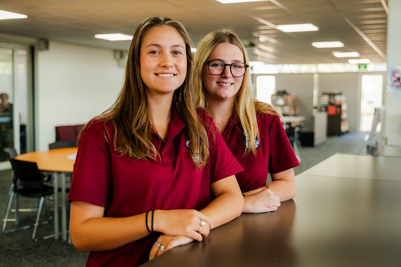 Students at Library circulation desk.
